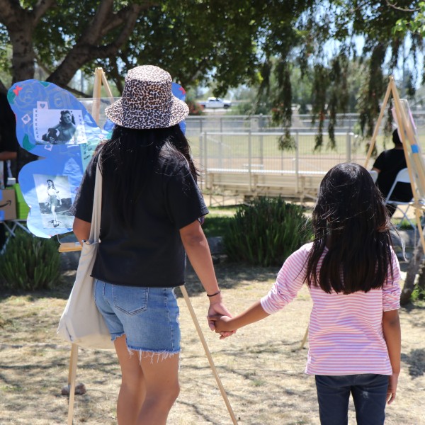 Community walks through the gallery