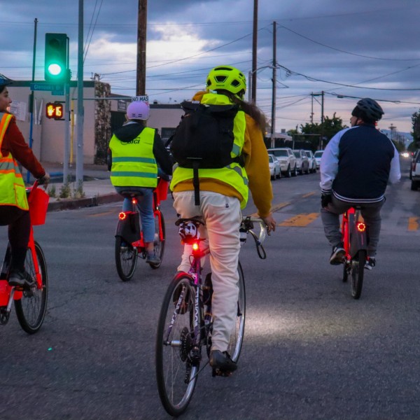 Electro-Bici riders participating in a community night ride 