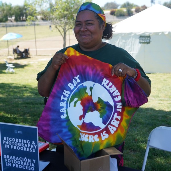 Cindy passing out Earth Day bandanas