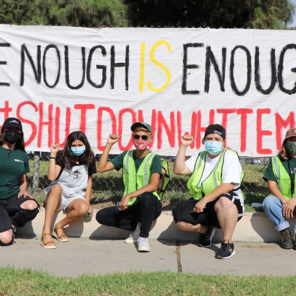 Community members protest for the shutdown of Whiteman Airport